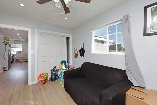 a bedroom with two beds and a closet