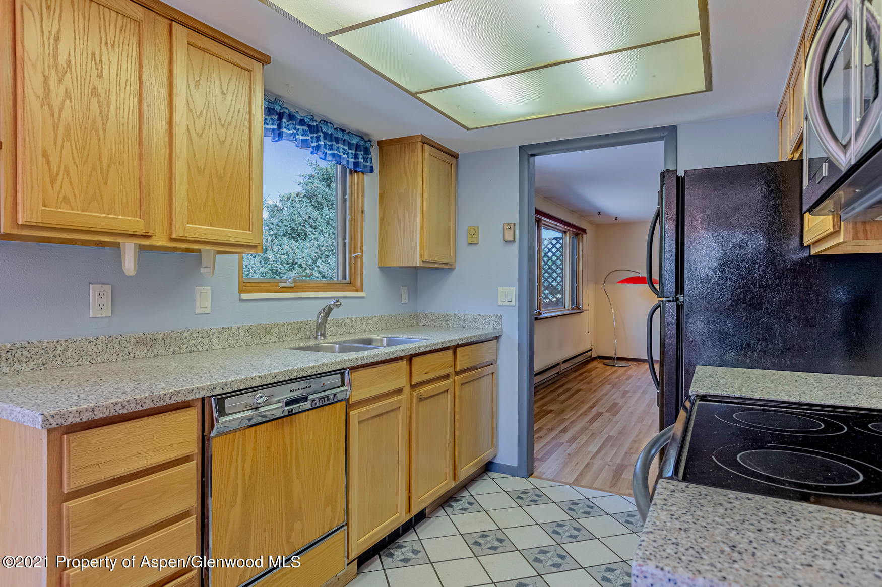 227 Holland Hills Road Basalt, CO 81621 - Photo 5 of 26 a kitchen with stainless steel appliances granite countertop sink stove and cabinets