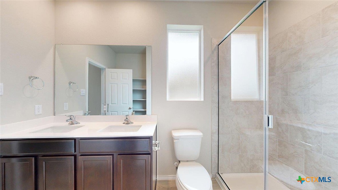 1111 Stone Vly Road Temple, TX 76502 - Photo 19 of 21 a bathroom with a sink a toilet and shower