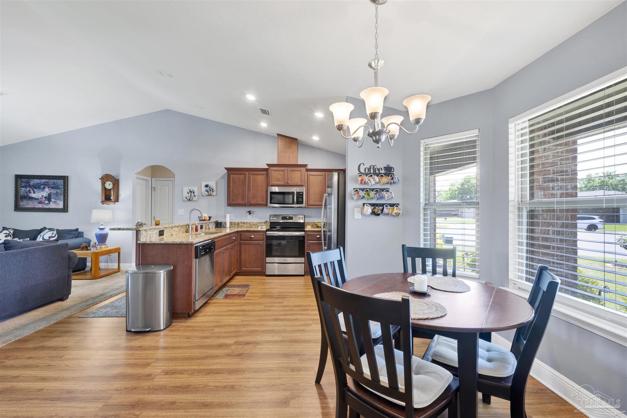 6336 Apple Ridge Circle Pensacola, FL 32526 - Photo 11 of 41 a large kitchen with a table and chairs