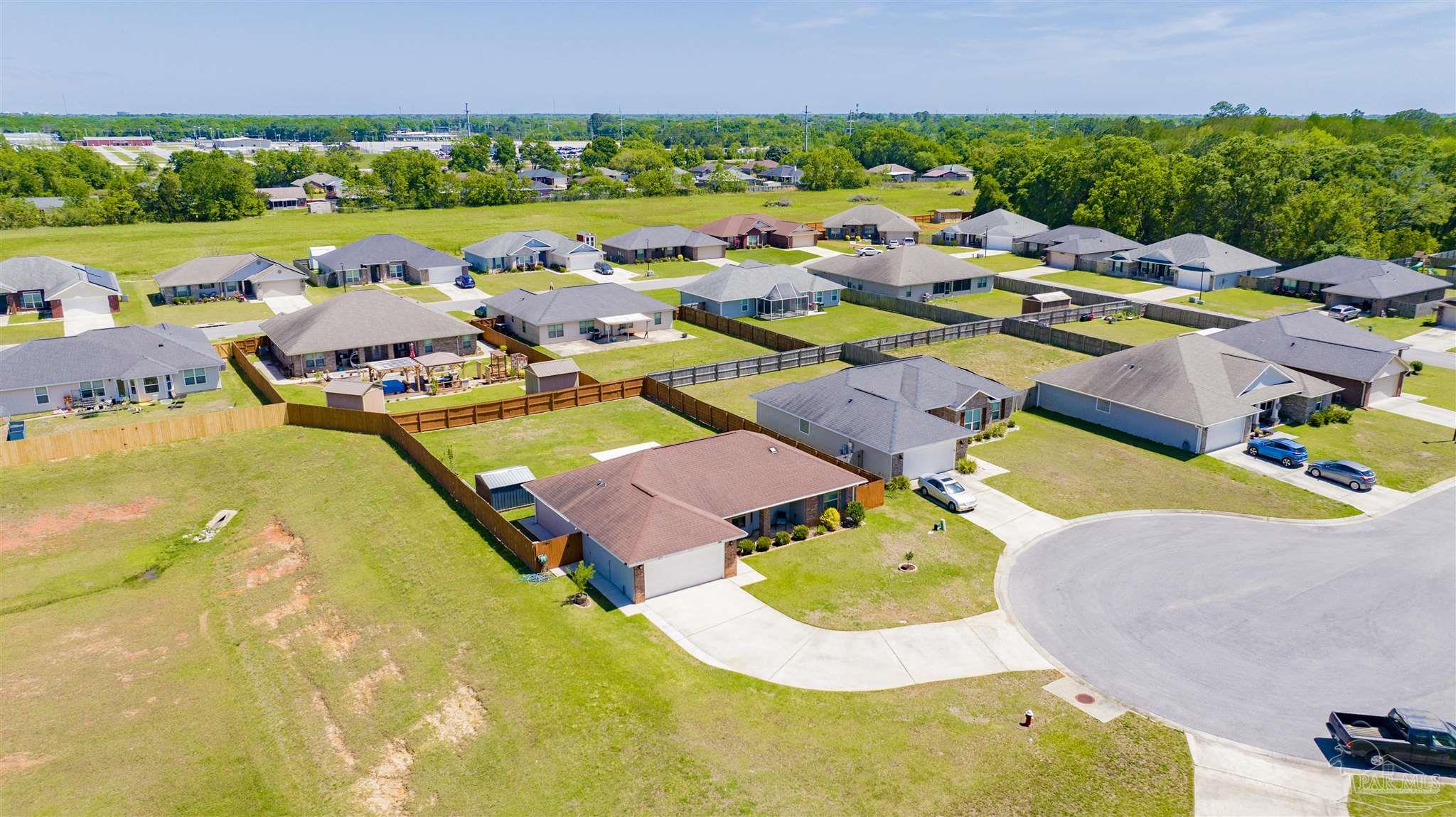 6336 Apple Ridge Circle Pensacola, FL 32526 - Photo 29 of 41 a aerial view of a swimming pool with outdoor seating and yard