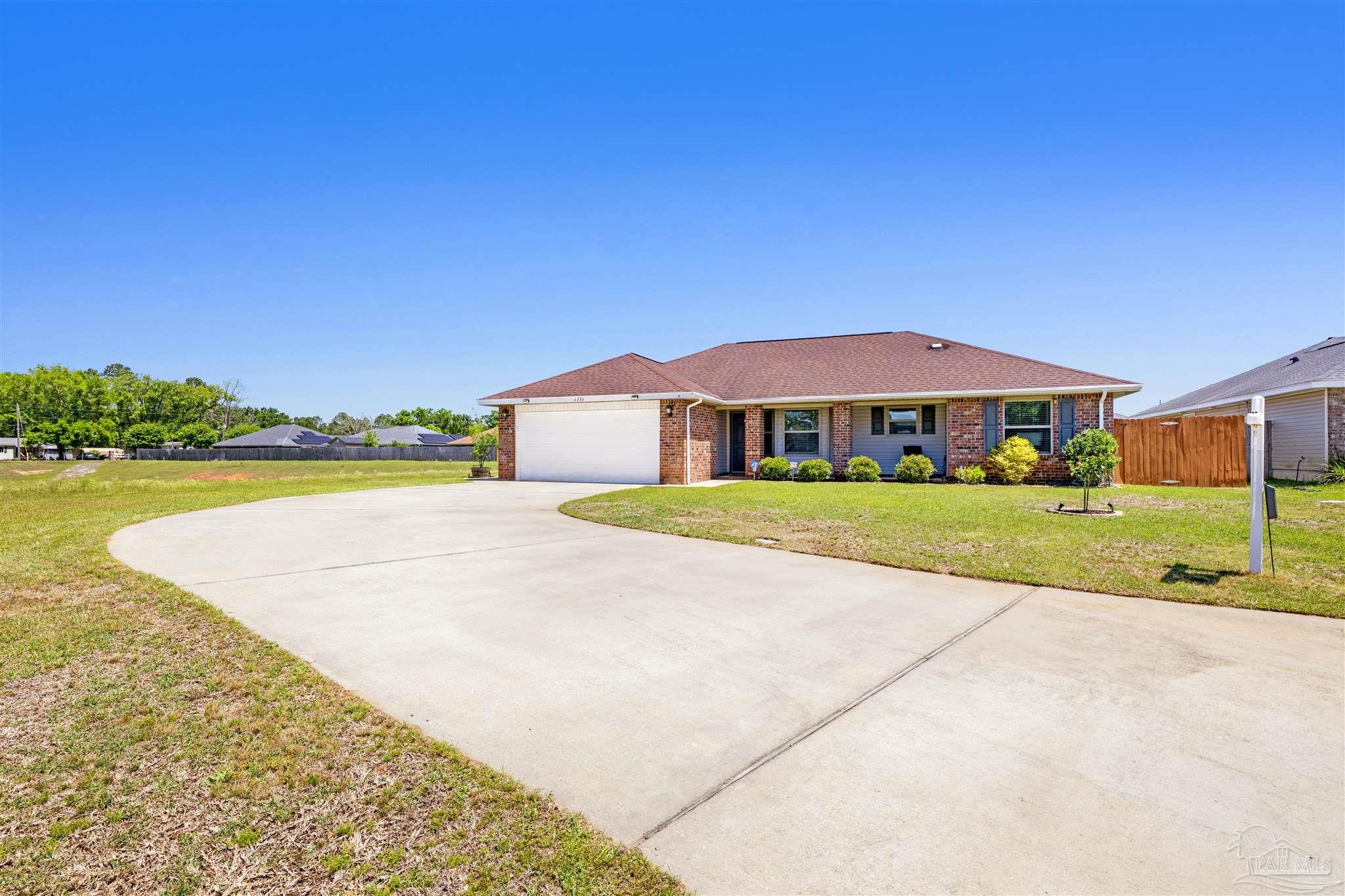 6336 Apple Ridge Circle Pensacola, FL 32526 - Photo 30 of 41 a view of an house with swimming pool and yard