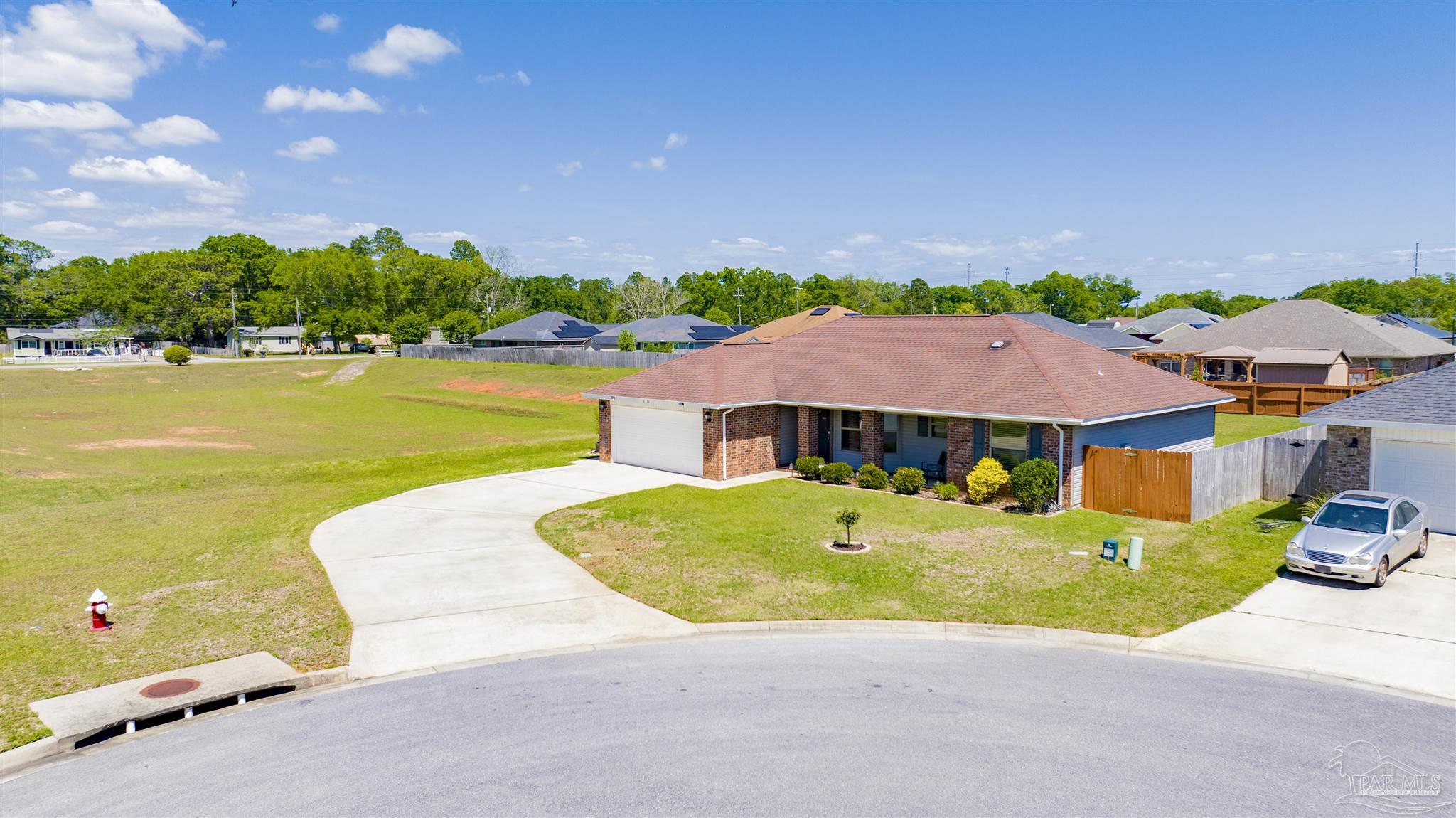 6336 Apple Ridge Circle Pensacola, FL 32526 - Photo 36 of 41 an aerial view of a house with garden space and outdoor seating
