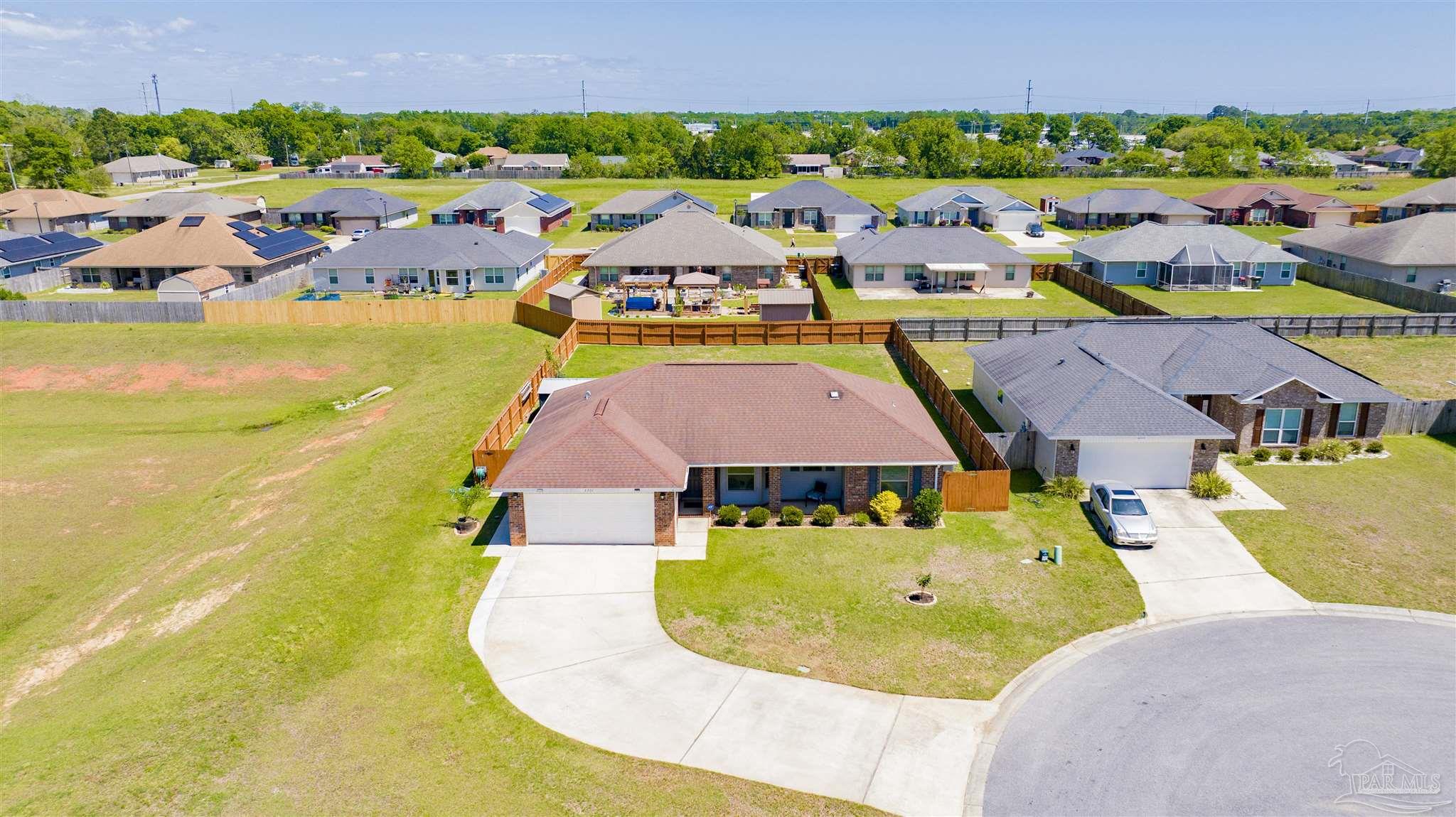 6336 Apple Ridge Circle Pensacola, FL 32526 - Photo 39 of 41 an aerial view of residential houses with outdoor space and swimming pool