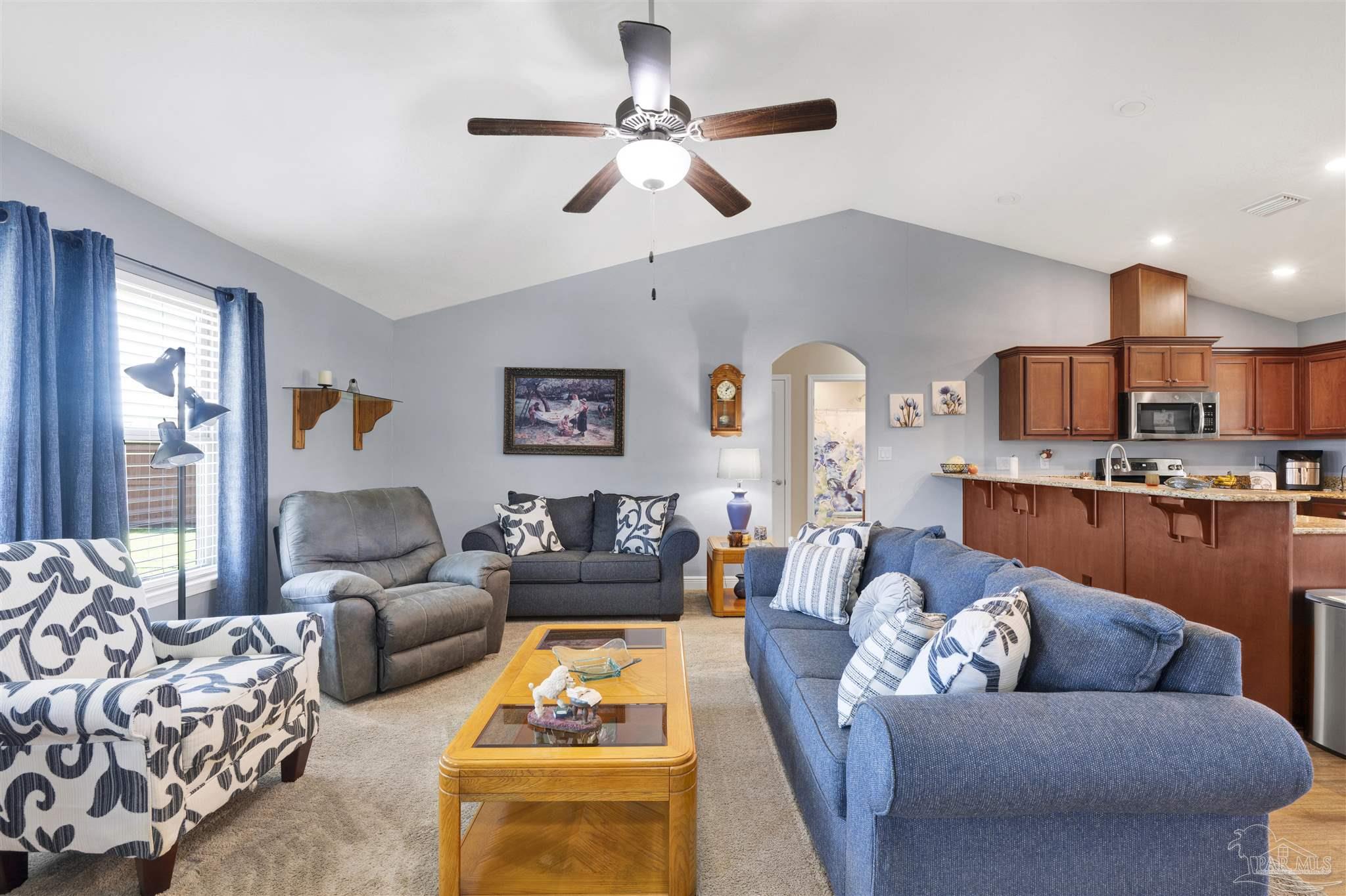 6336 Apple Ridge Circle Pensacola, FL 32526 - Photo 5 of 41 a living room with furniture kitchen view and a chandelier
