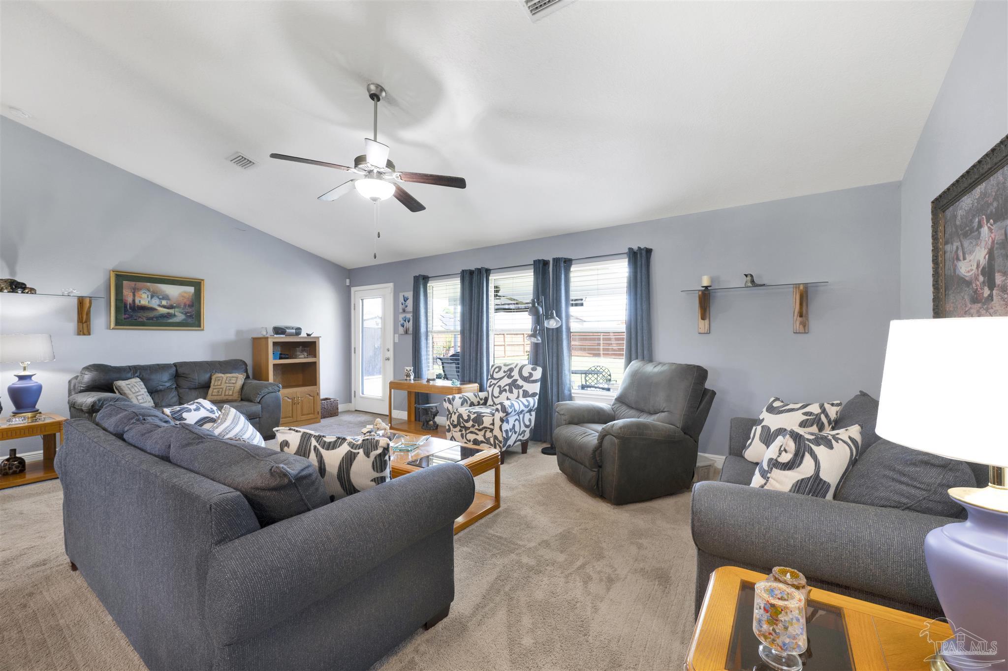 6336 Apple Ridge Circle Pensacola, FL 32526 - Photo 6 of 41 a living room with furniture ceiling fan and a window