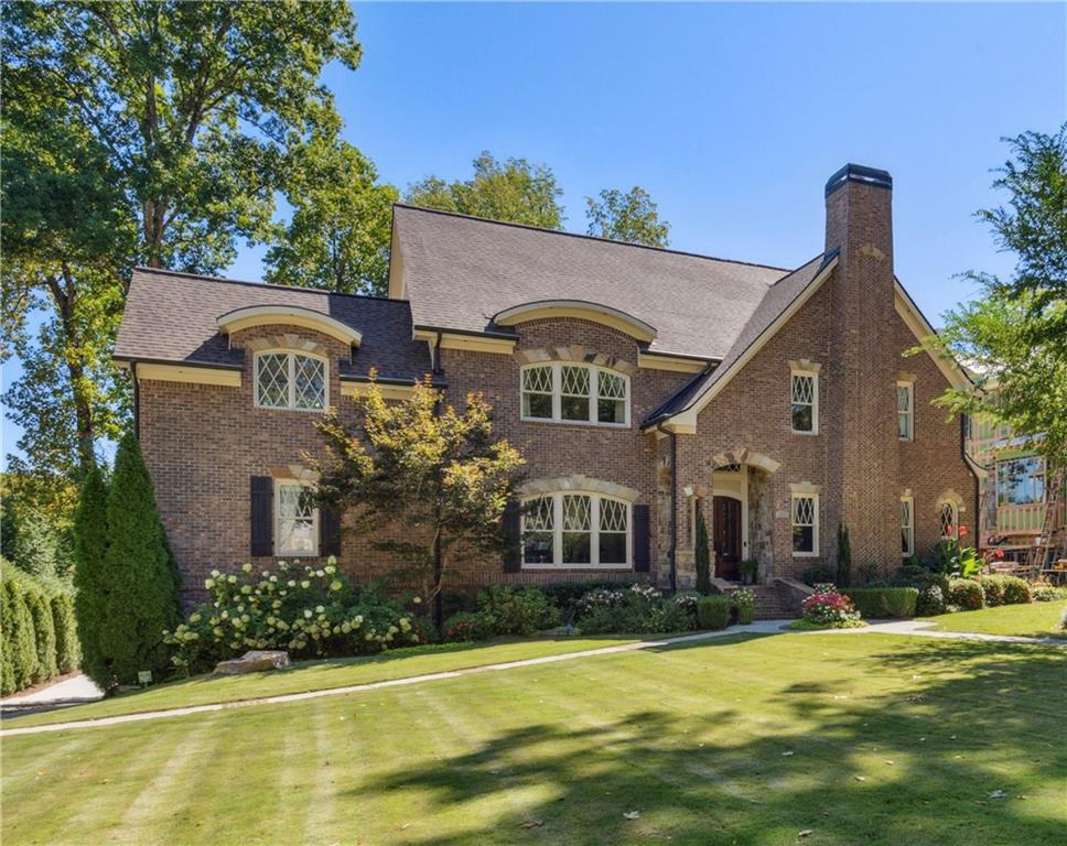 1601 Friar Tuck Road Northeast Atlanta, GA 30309 - Photo 1 of 1 a front view of a house with a yard