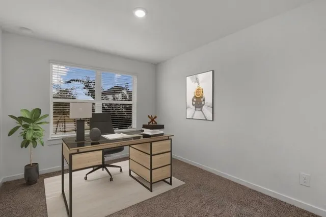 an aerial view of a house with outdoor space