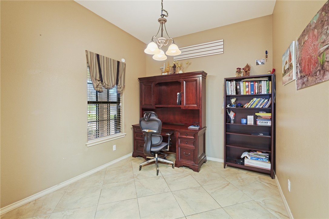 314 Hancock Odem, TX 78370 - Photo 11 of 30 a view of a workspace with furniture and a window