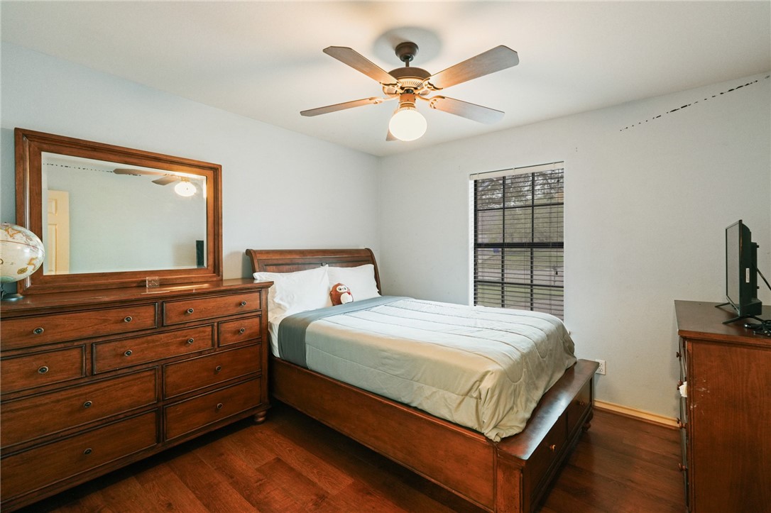 314 Hancock Odem, TX 78370 - Photo 29 of 30 a bedroom with a bed and a flat tv screen on dresser