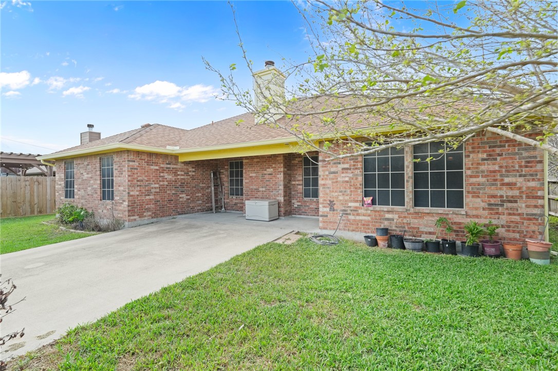 314 Hancock Odem, TX 78370 - Photo 4 of 30 a front view of a house with a yard and porch
