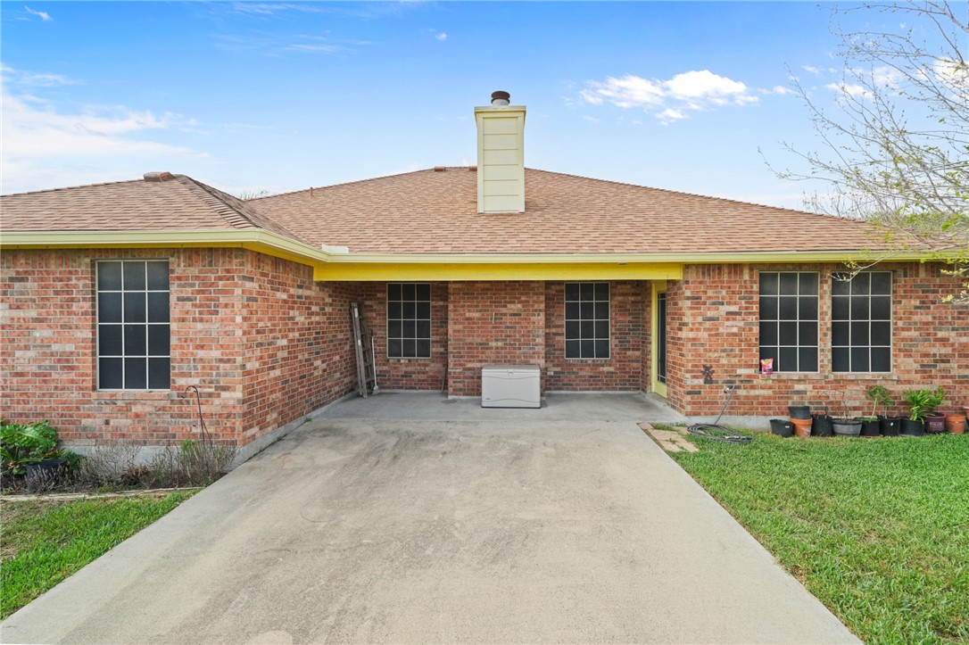 314 Hancock Odem, TX 78370 - Photo 6 of 30 a front view of a house with a yard and garage