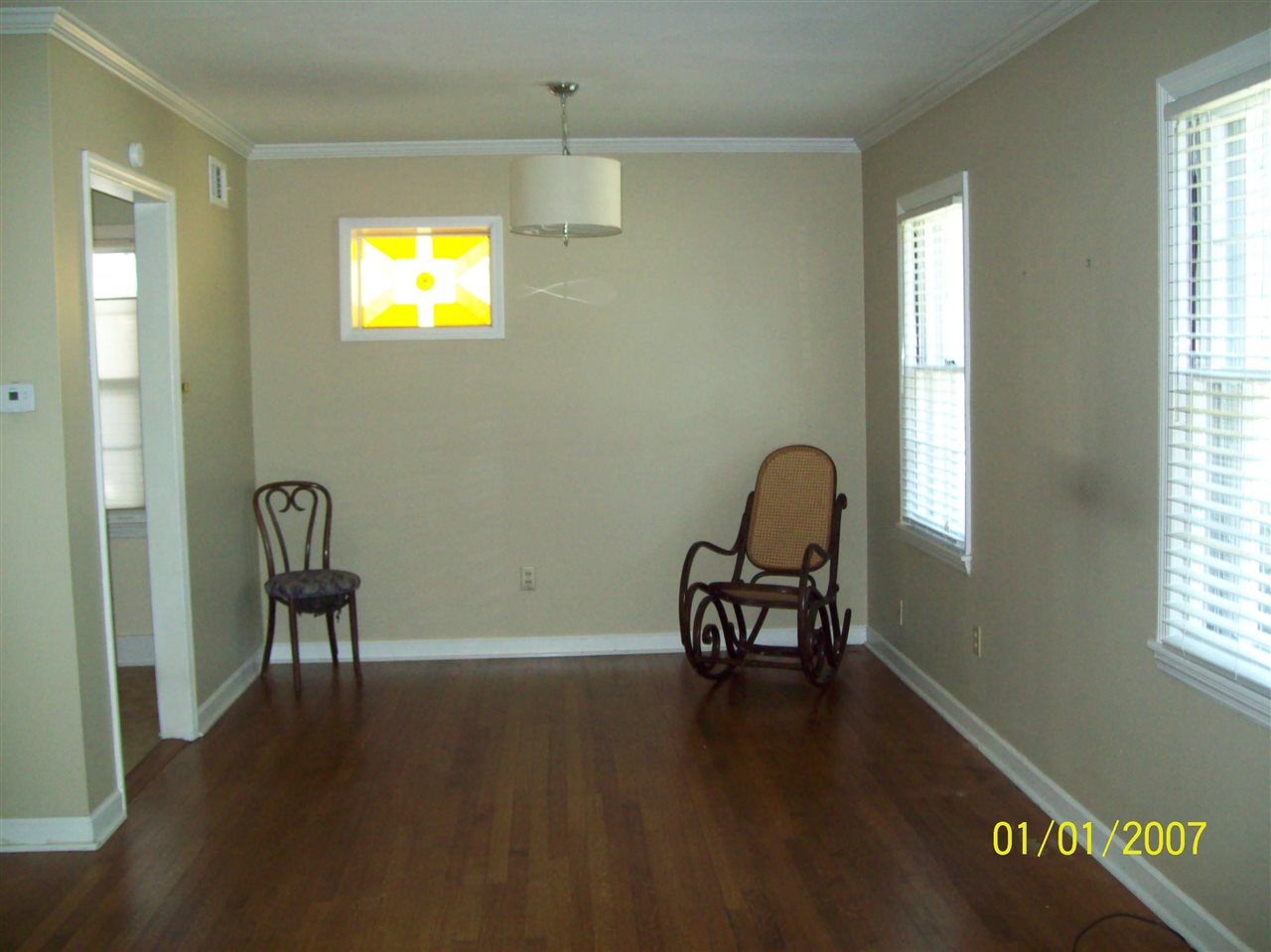 1663 Welsh Road Memphis, TN 38117 - Photo 3 of 12 an empty room with wooden floor and windows