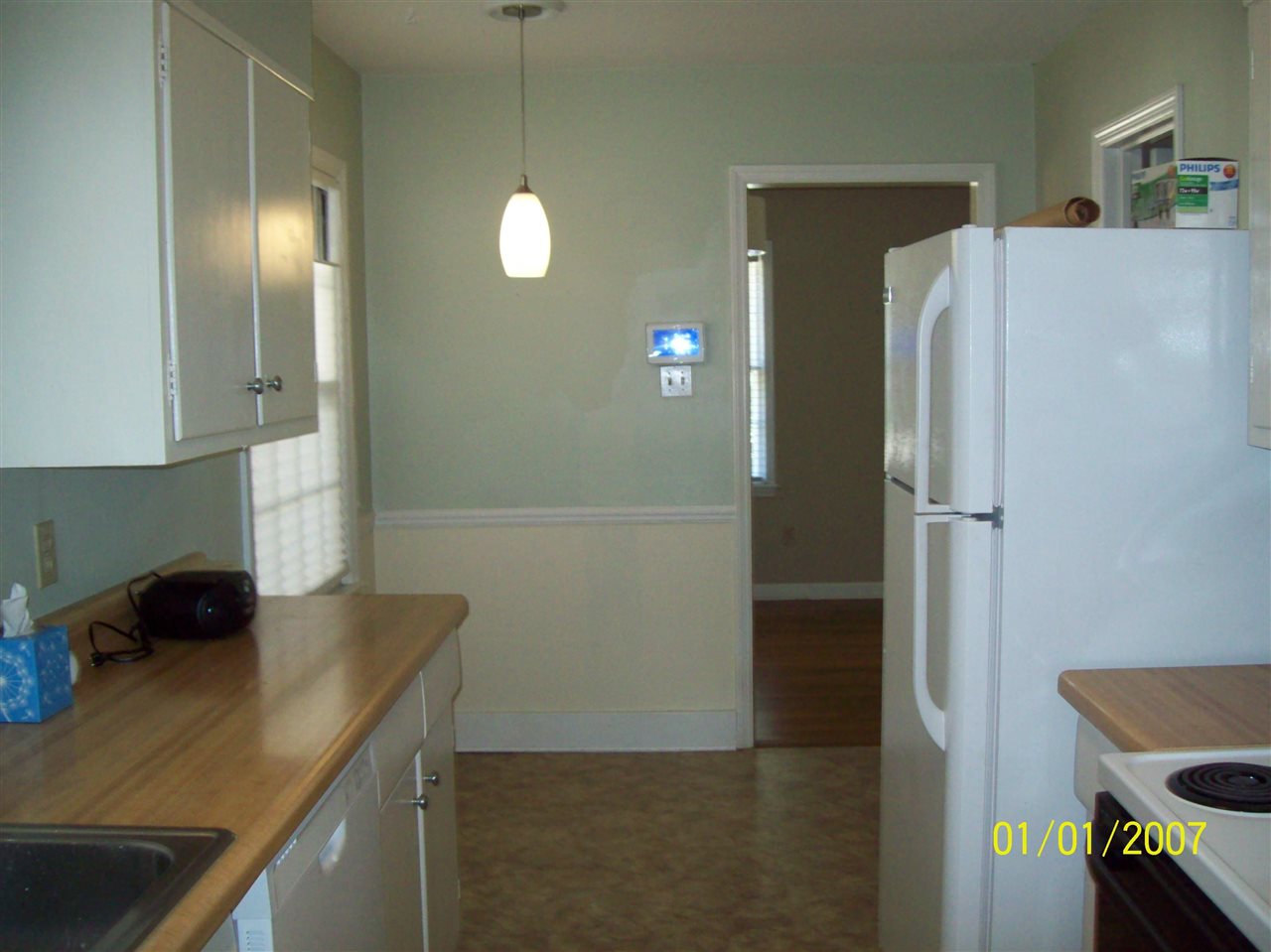 1663 Welsh Road Memphis, TN 38117 - Photo 5 of 12 a kitchen with sink a refrigerator and a stove