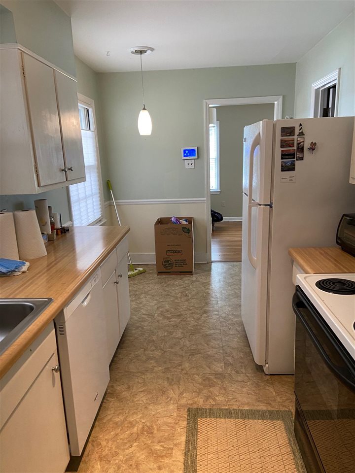 1663 Welsh Road Memphis, TN 38117 - Photo 6 of 12 a kitchen with a refrigerator and countertop