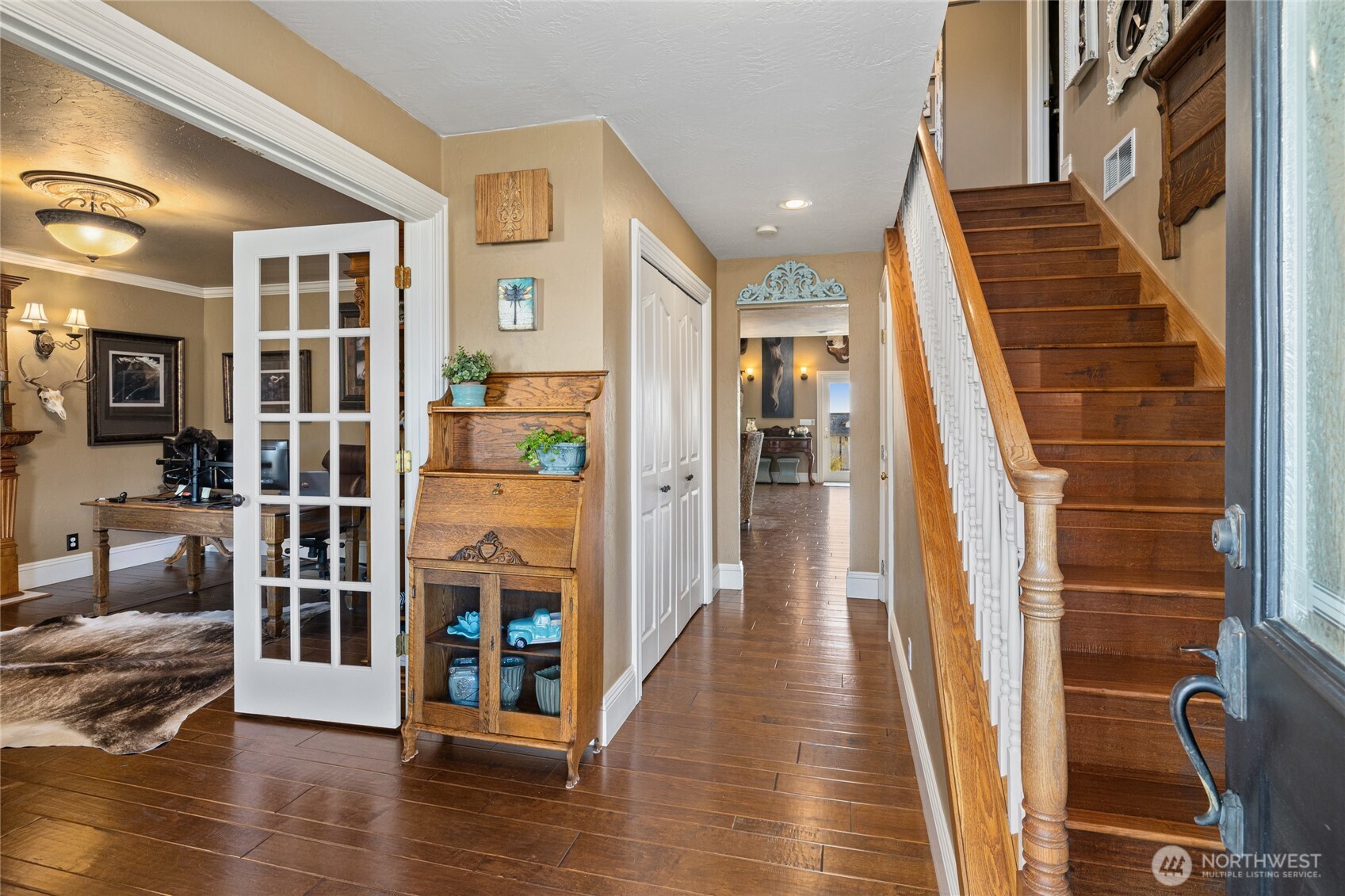 1800 Strande Road Ellensburg, WA 98926 - Photo 3 of 40 a view of a hallway with wooden floor and staircase