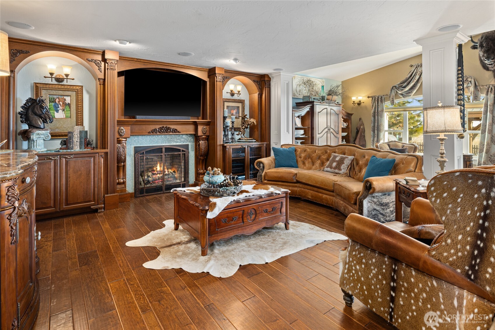 1800 Strande Road Ellensburg, WA 98926 - Photo 5 of 40 a living room with furniture a fireplace and a flat screen tv