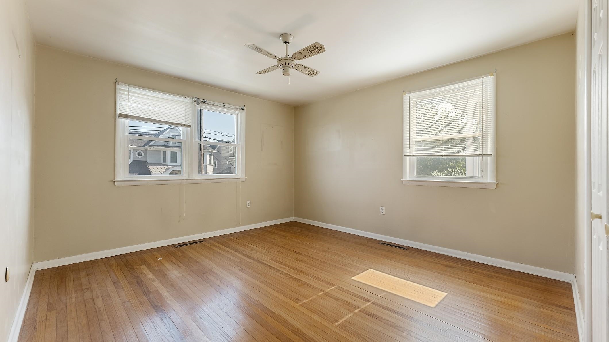 74 Walnut Road Ocean City, NJ 08226 - Photo 12 of 35 a view of an empty room with wooden floor and a window
