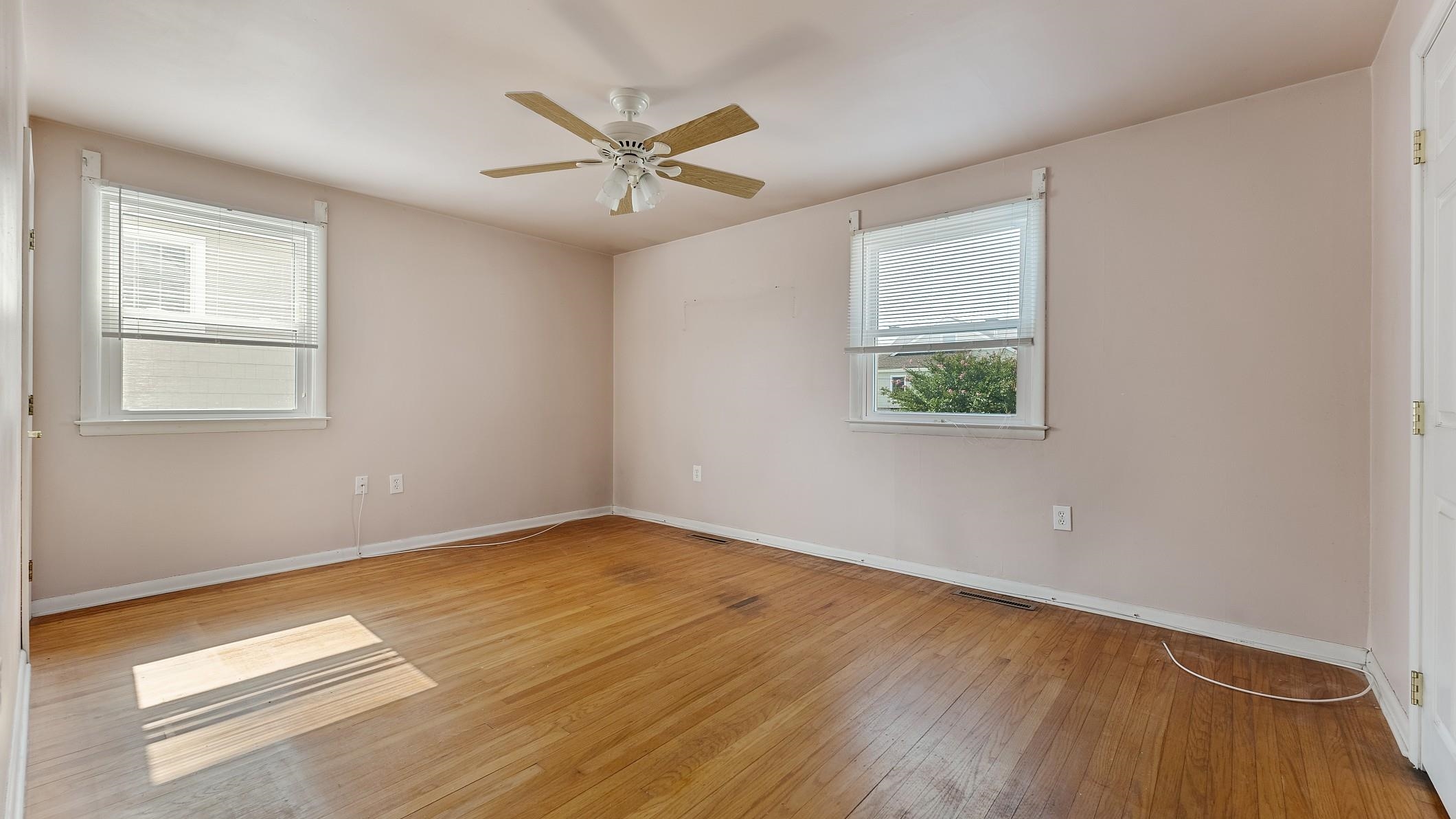74 Walnut Road Ocean City, NJ 08226 - Photo 14 of 35 a view of an empty room with wooden floor and a window