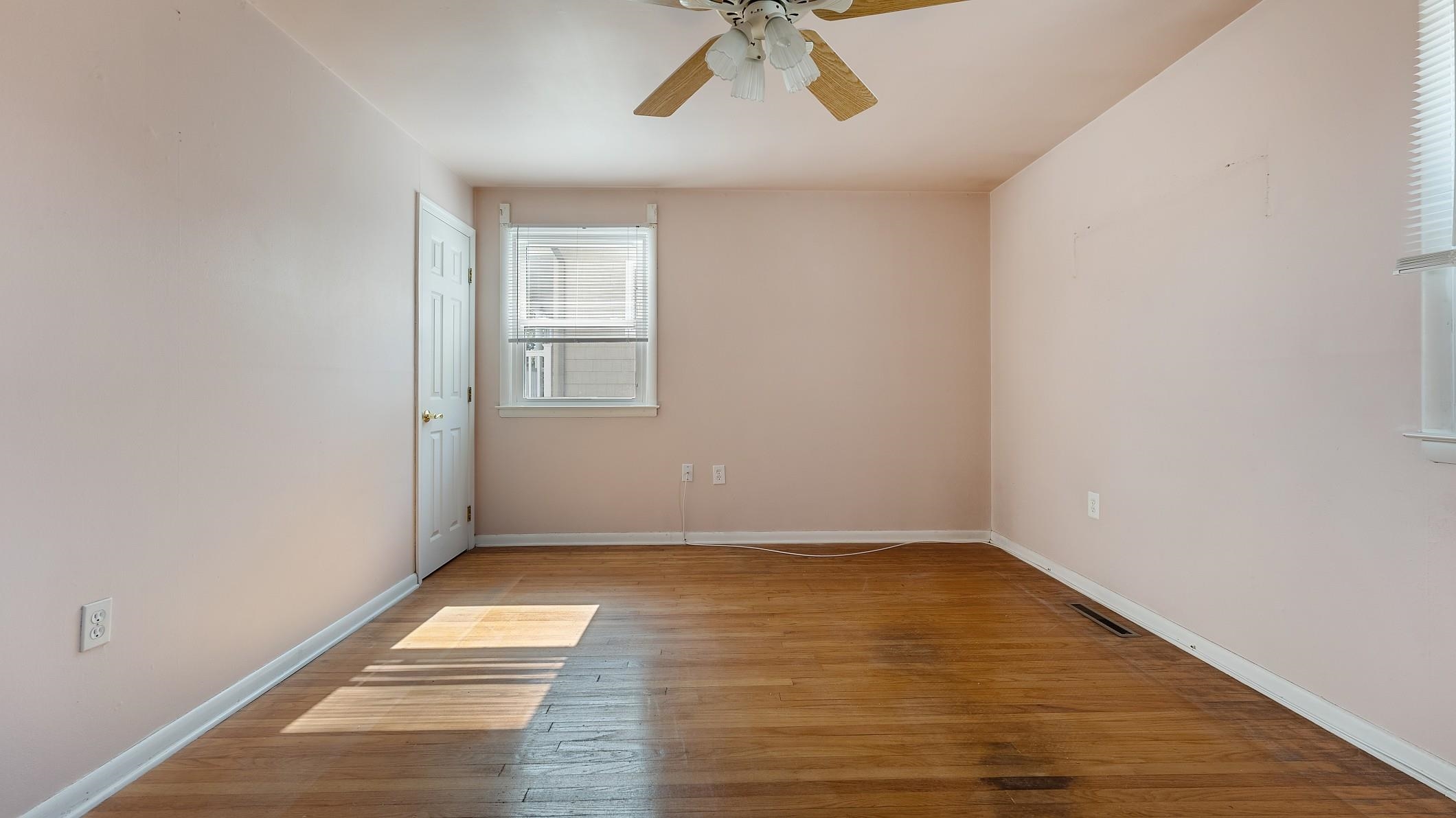 74 Walnut Road Ocean City, NJ 08226 - Photo 15 of 35 wooden floor in an empty room with a window