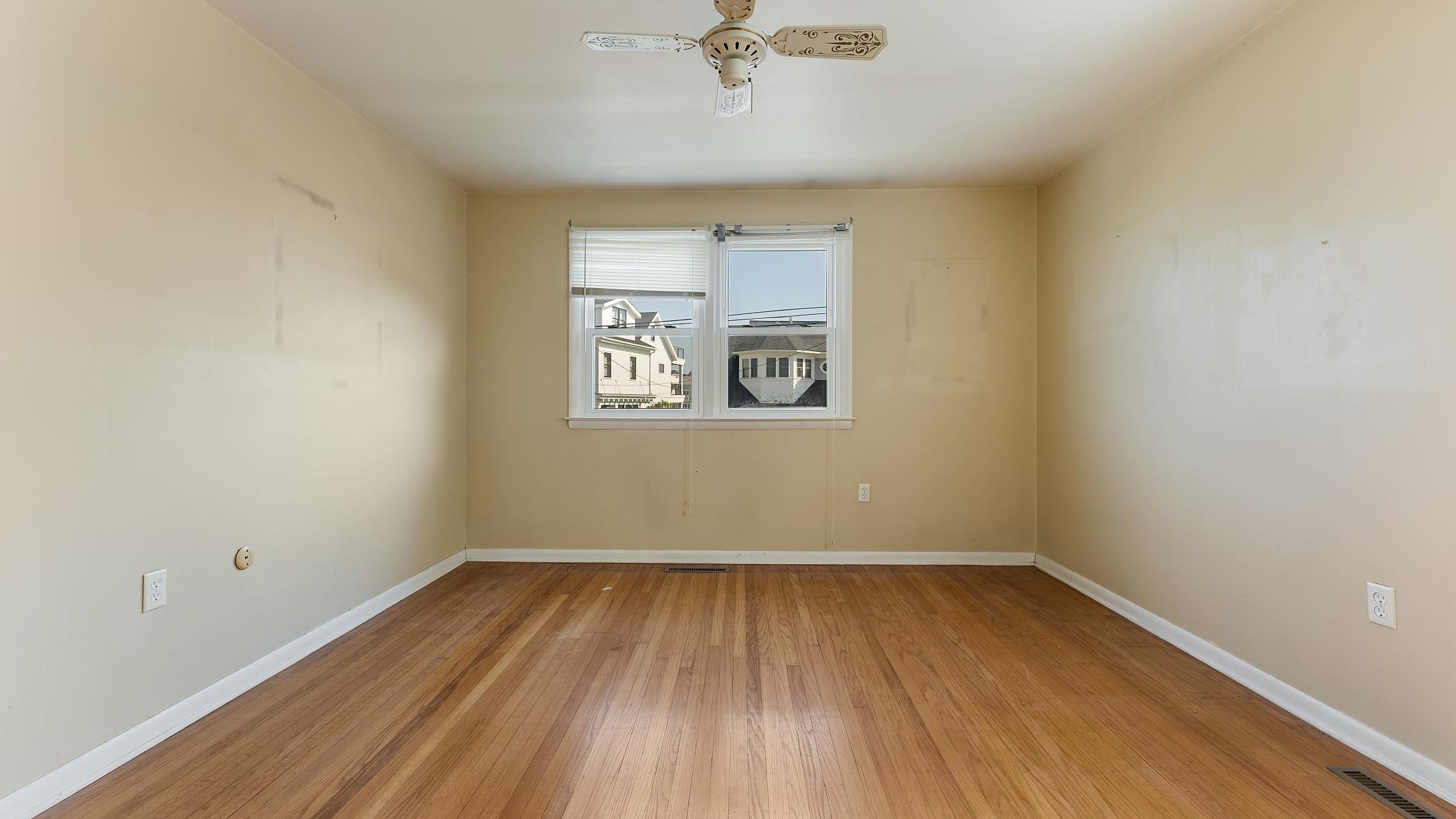 74 Walnut Road Ocean City, NJ 08226 - Photo 16 of 35 wooden floor in an empty room with a window