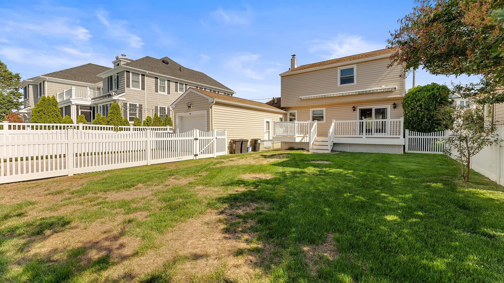 74 Walnut Road Ocean City, NJ 08226 - Photo 2 of 35 a front view of a house with a yard