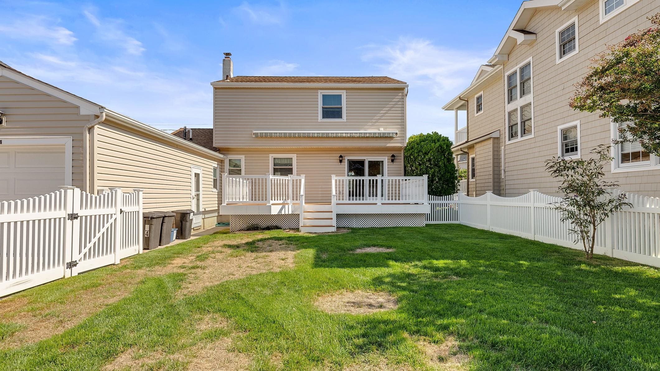 74 Walnut Road Ocean City, NJ 08226 - Photo 24 of 35 a front view of a house with a yard