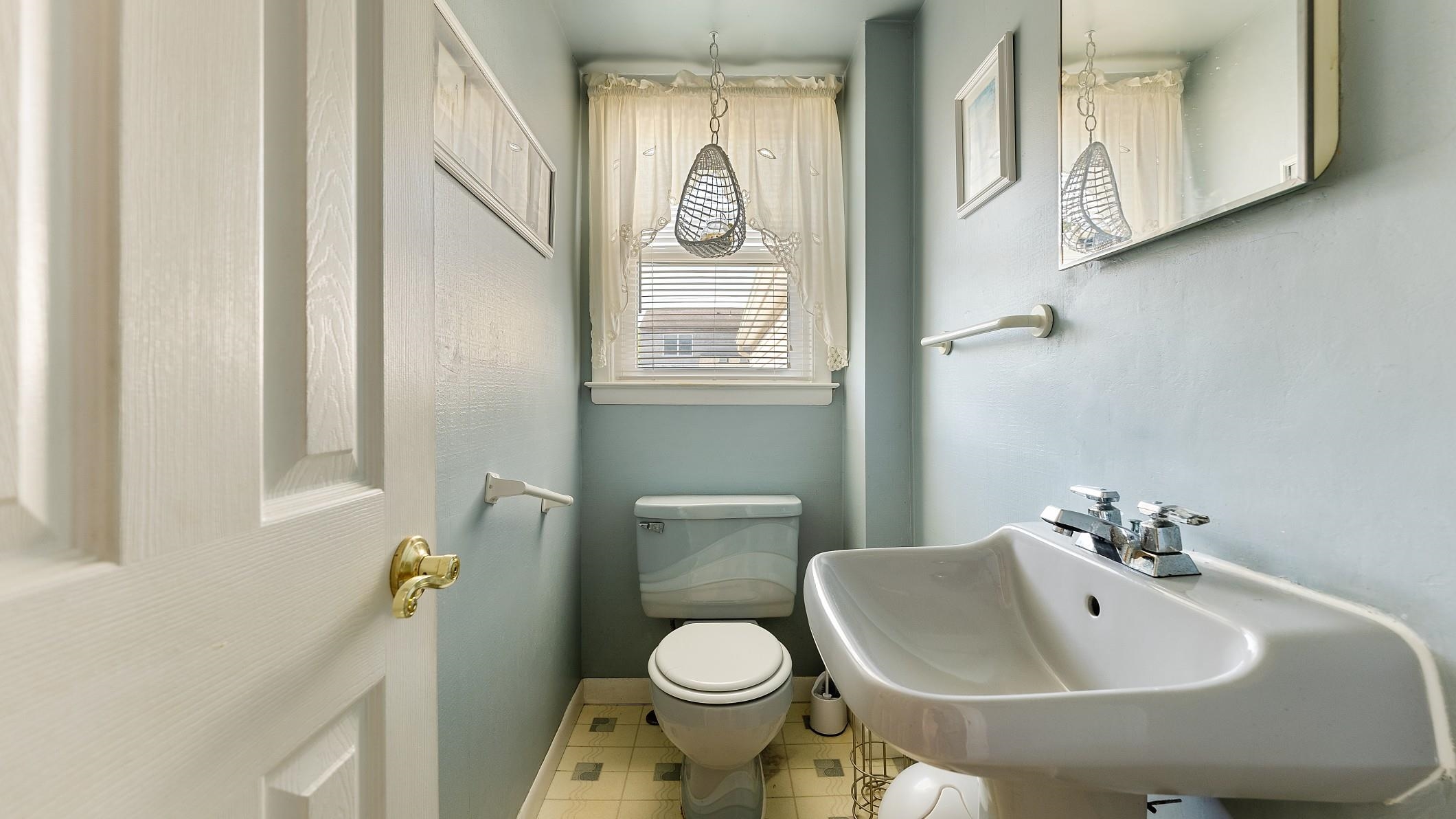 74 Walnut Road Ocean City, NJ 08226 - Photo 25 of 35 a bathroom with a sink a toilet and a mirror