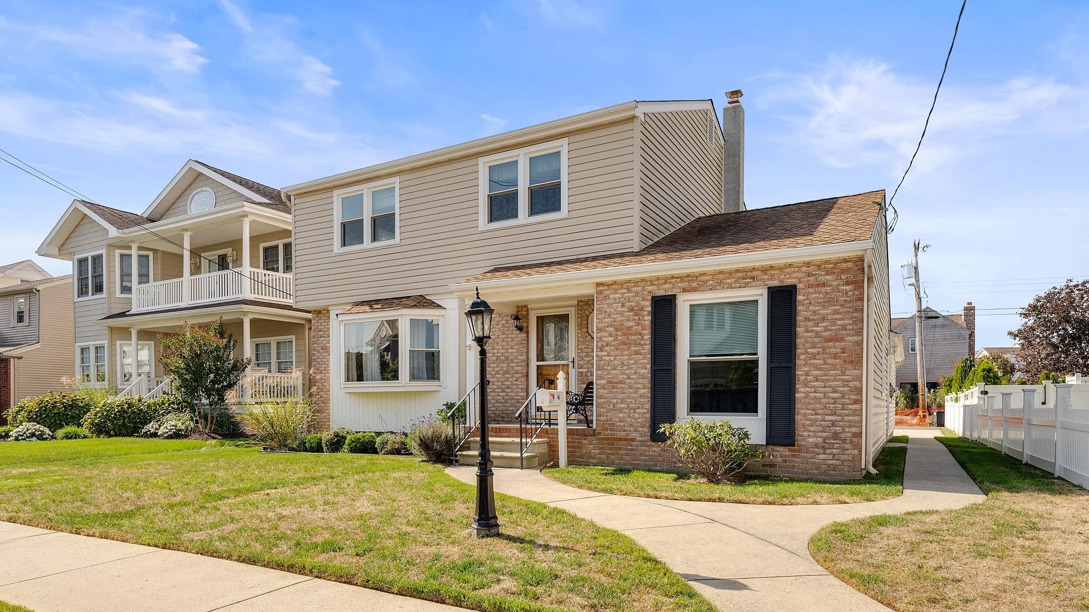74 Walnut Road Ocean City, NJ 08226 - Photo 35 of 35 a front view of a house with garden