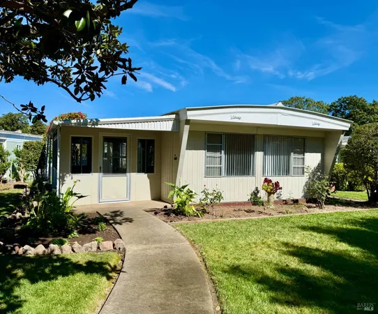 a front view of a house with a garden and porch