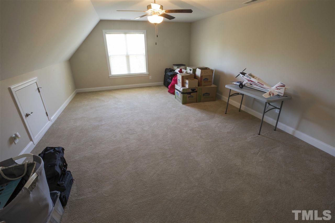1309 Silver Farm Road Raleigh, NC 27603 - Photo 13 of 24 a living room with furniture and a window