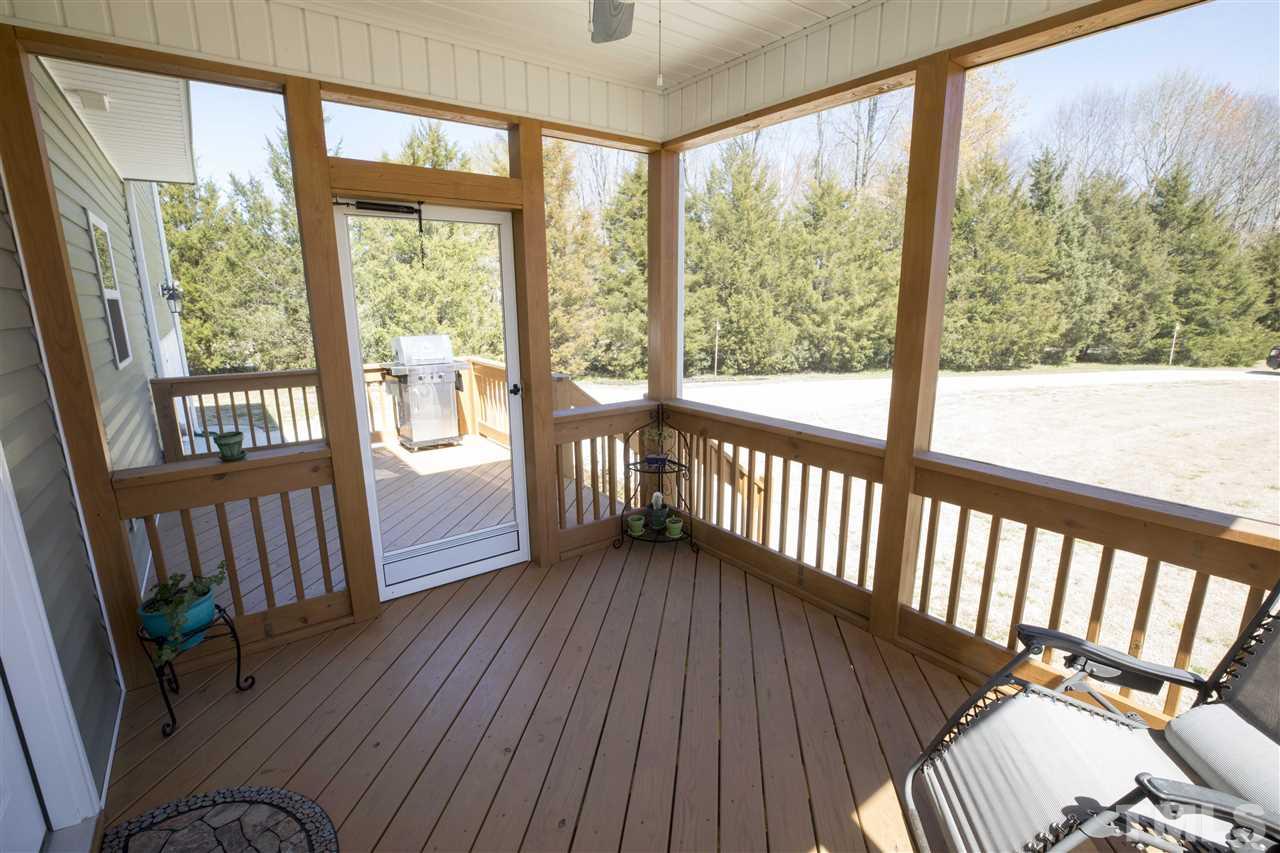 1309 Silver Farm Road Raleigh, NC 27603 - Photo 21 of 24 a view of a porch with wooden floor