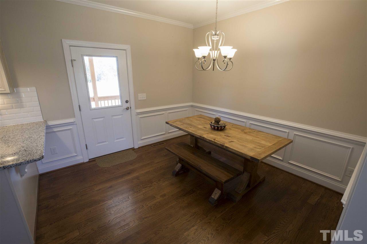 1309 Silver Farm Road Raleigh, NC 27603 - Photo 6 of 24 a view of a room with wooden floor and cabinet