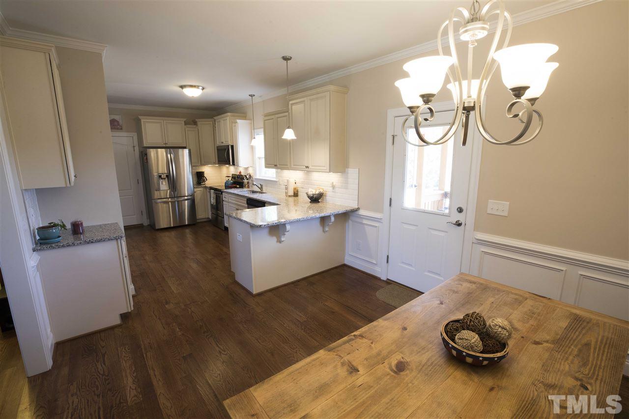 1309 Silver Farm Road Raleigh, NC 27603 - Photo 7 of 24 a living room with furniture and a window