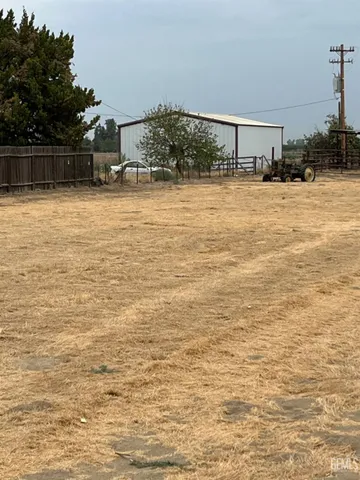 a view of a yard with a trees