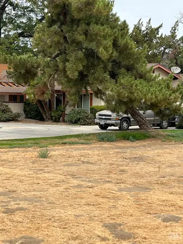 a house with trees in the background