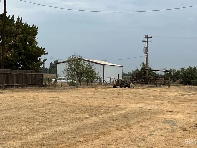 a swimming pool with an outdoor space and seating area