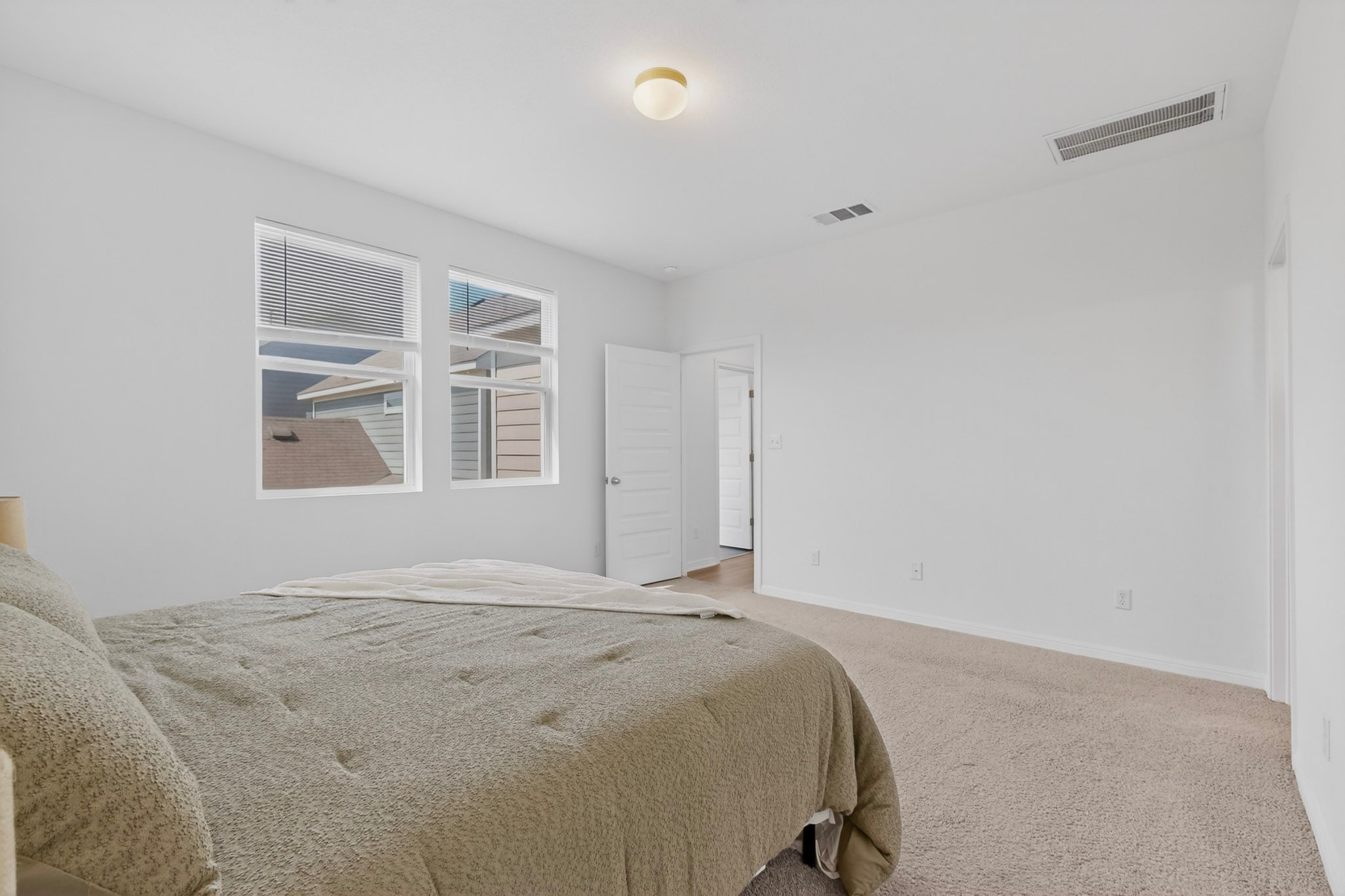 2524 Acoma Lane Leander, TX 78641 - Photo 13 of 27 a bedroom with a bed and a window