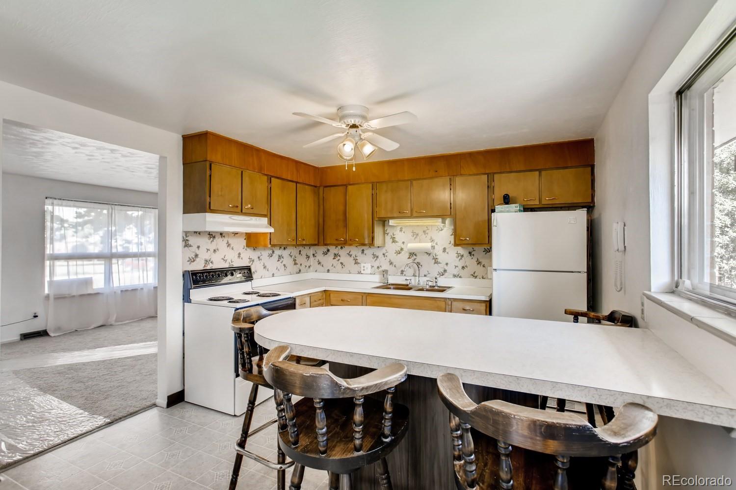 16060 Mt Vernon Road Golden, CO 80401 - Photo 1 of 29 a view of a dining room with furniture and window