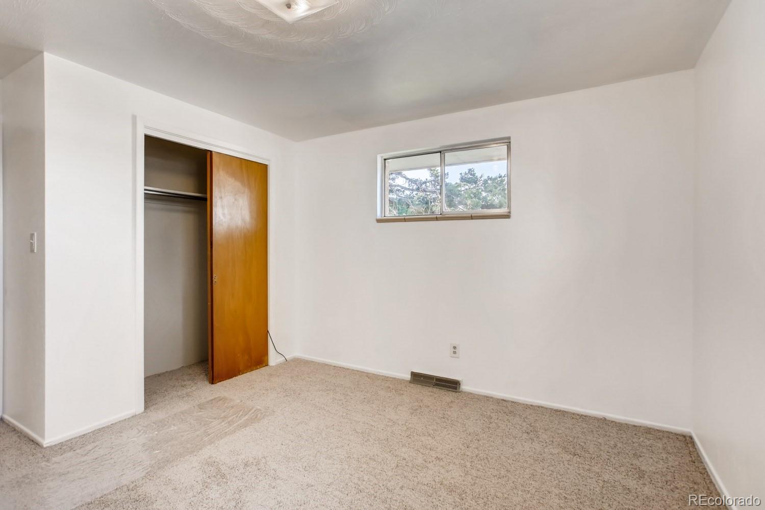 16060 Mt Vernon Road Golden, CO 80401 - Photo 16 of 29 an empty room with a hallway