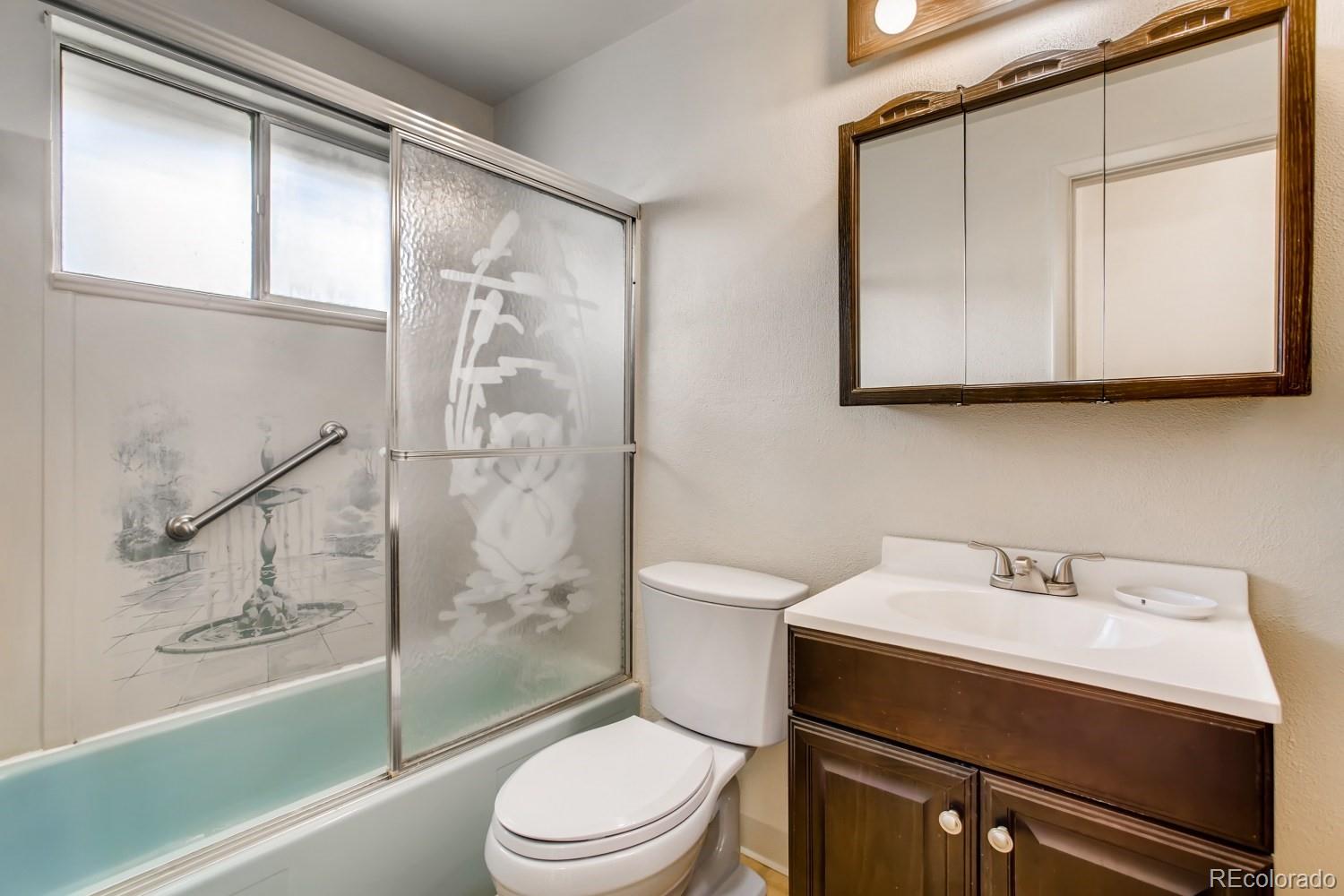 16060 Mt Vernon Road Golden, CO 80401 - Photo 18 of 29 a bathroom with a sink a toilet and shower