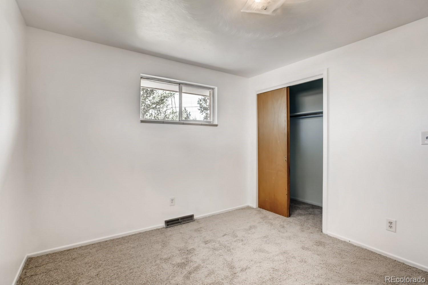 16060 Mt Vernon Road Golden, CO 80401 - Photo 20 of 29 an empty room with a hallway