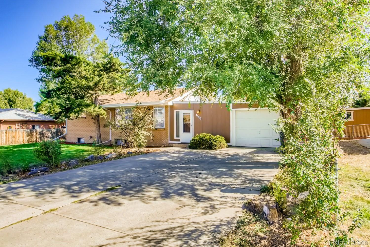 16060 Mt Vernon Road Golden, CO 80401 - Photo 2 of 29 a view of a house with a tree and plants