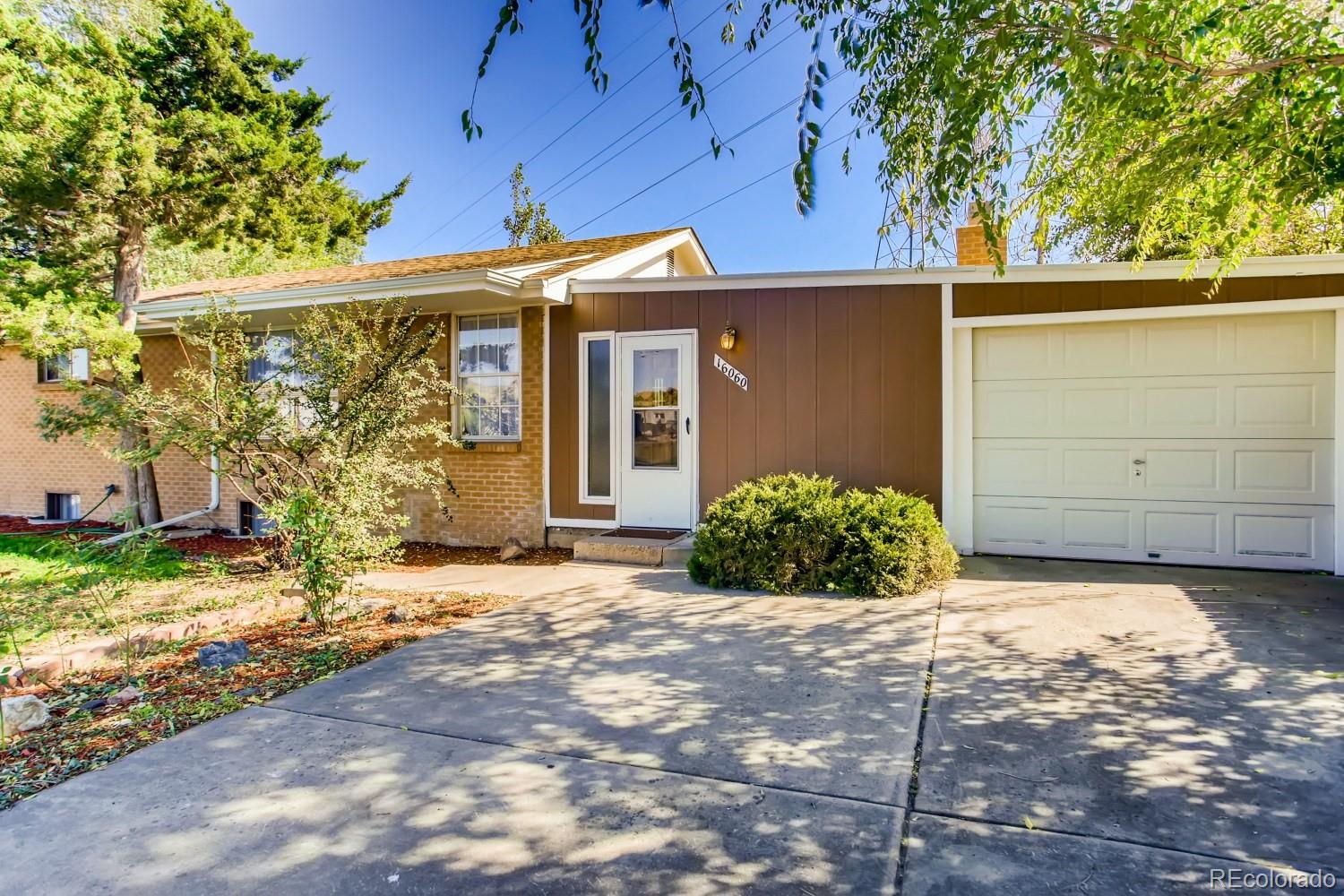 16060 Mt Vernon Road Golden, CO 80401 - Photo 6 of 29 a view of a house with a yard
