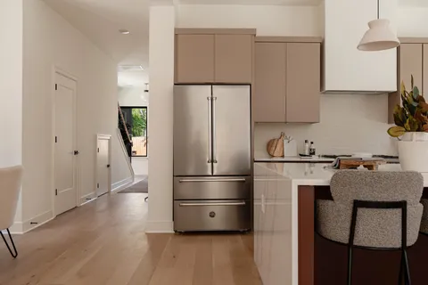 a living room with furniture and a mirror
