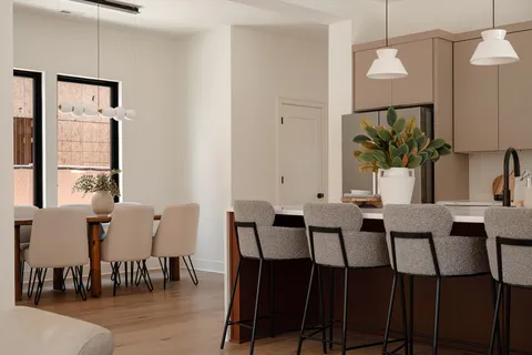 a bedroom with a large bed and a large window