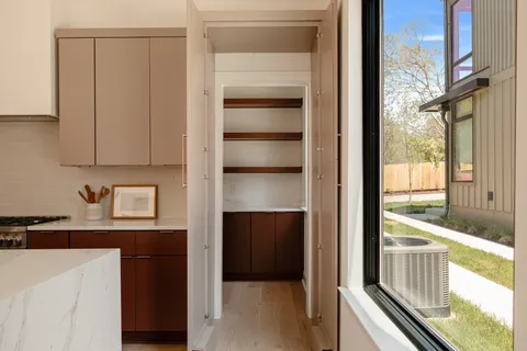 a bedroom with a bed and a mirror