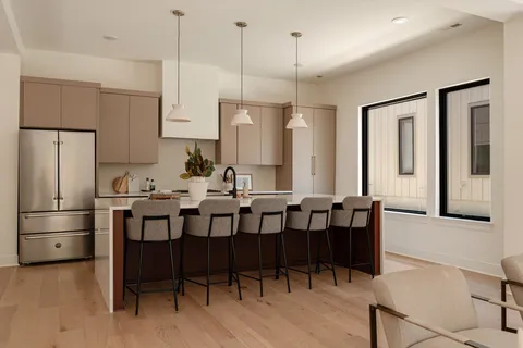 a bathroom with a double vanity sink and a bathtub