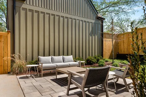 a view of a dining room with furniture and window