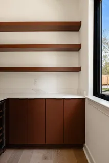 a view of a patio with table and chairs with wooden floor and fence